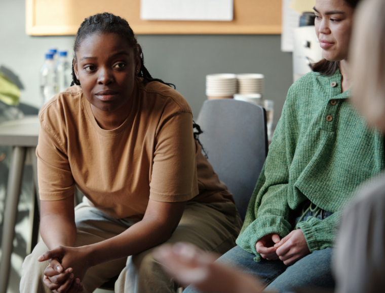 Portriait of a young woman in a group meeting setting