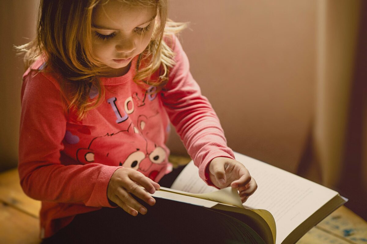 Little girl with a story book